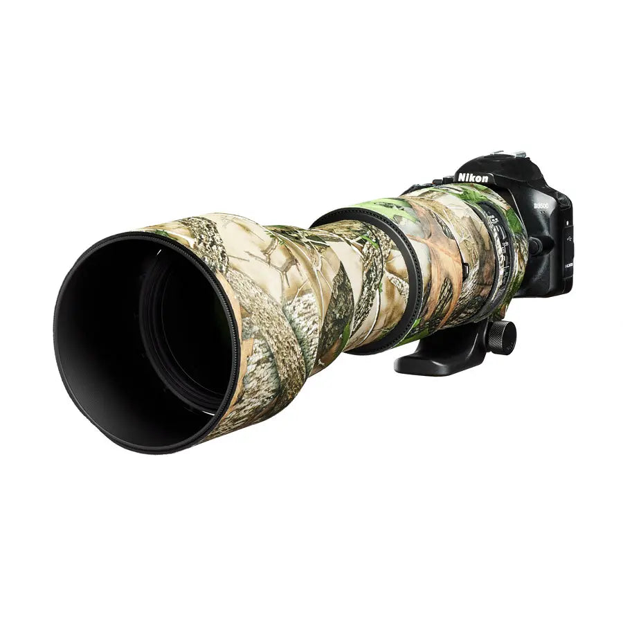 Camouflage lens cover on a Nikon camera lens with a white background