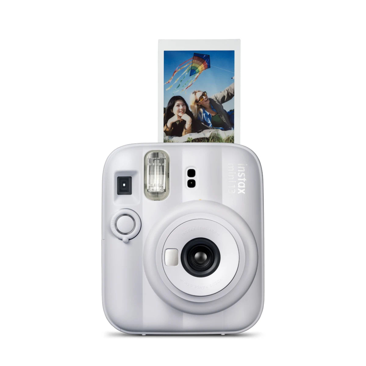 White instant camera with a photo of two people and a kite on the display, on a white background.
