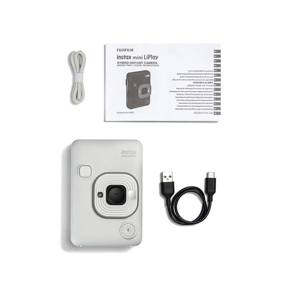 Fujifilm Instax mini LiPlay camera with USB cable and packaging on a white background