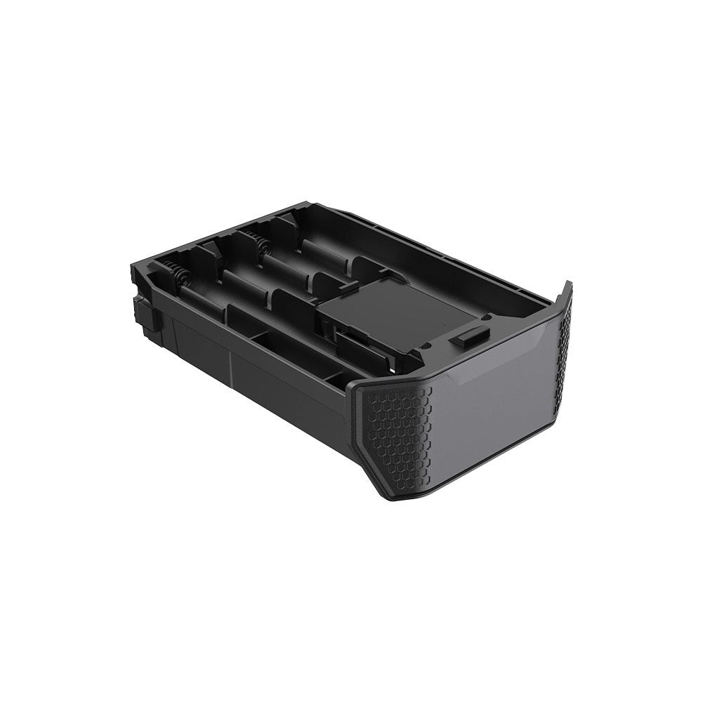 A black plastic battery compartment cover or protective housing with textured grip patterns on the outer edges, shown on a plain white background.