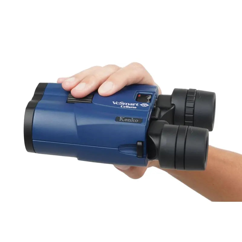 Blue binoculars held in a hand on a white background