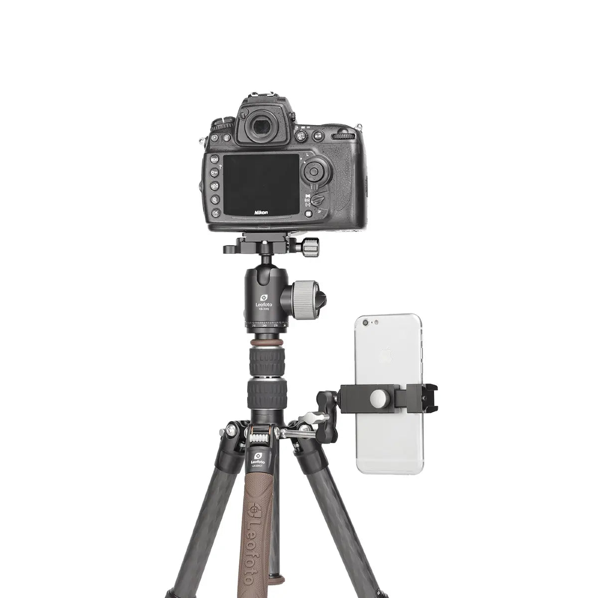 Camera on a tripod with smartphone holder on a white background