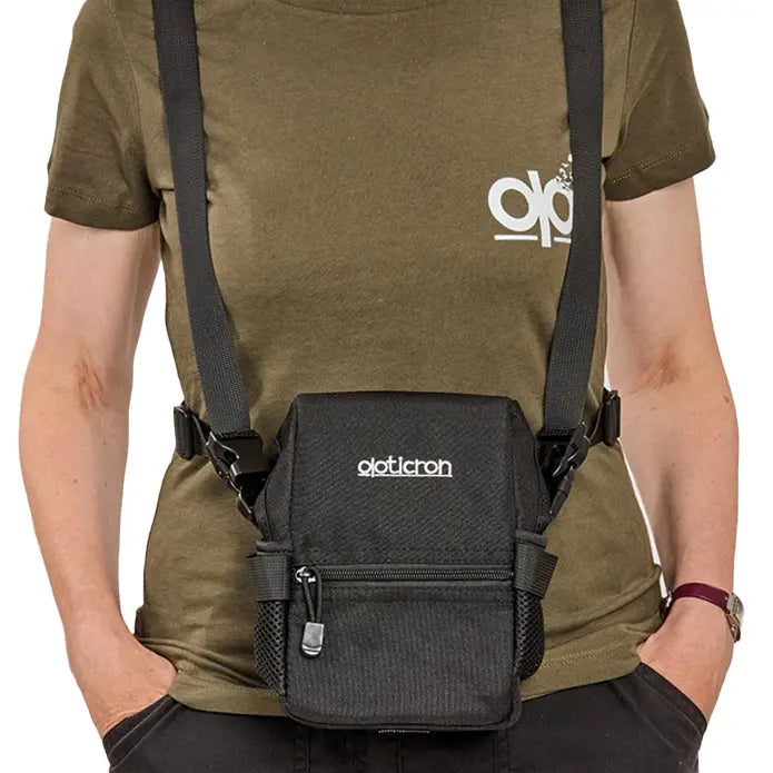 Person wearing a black tactical vest with 'Olight' branding on a white background