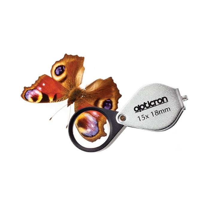 Opticron magnifying glass with a butterfly on a white background