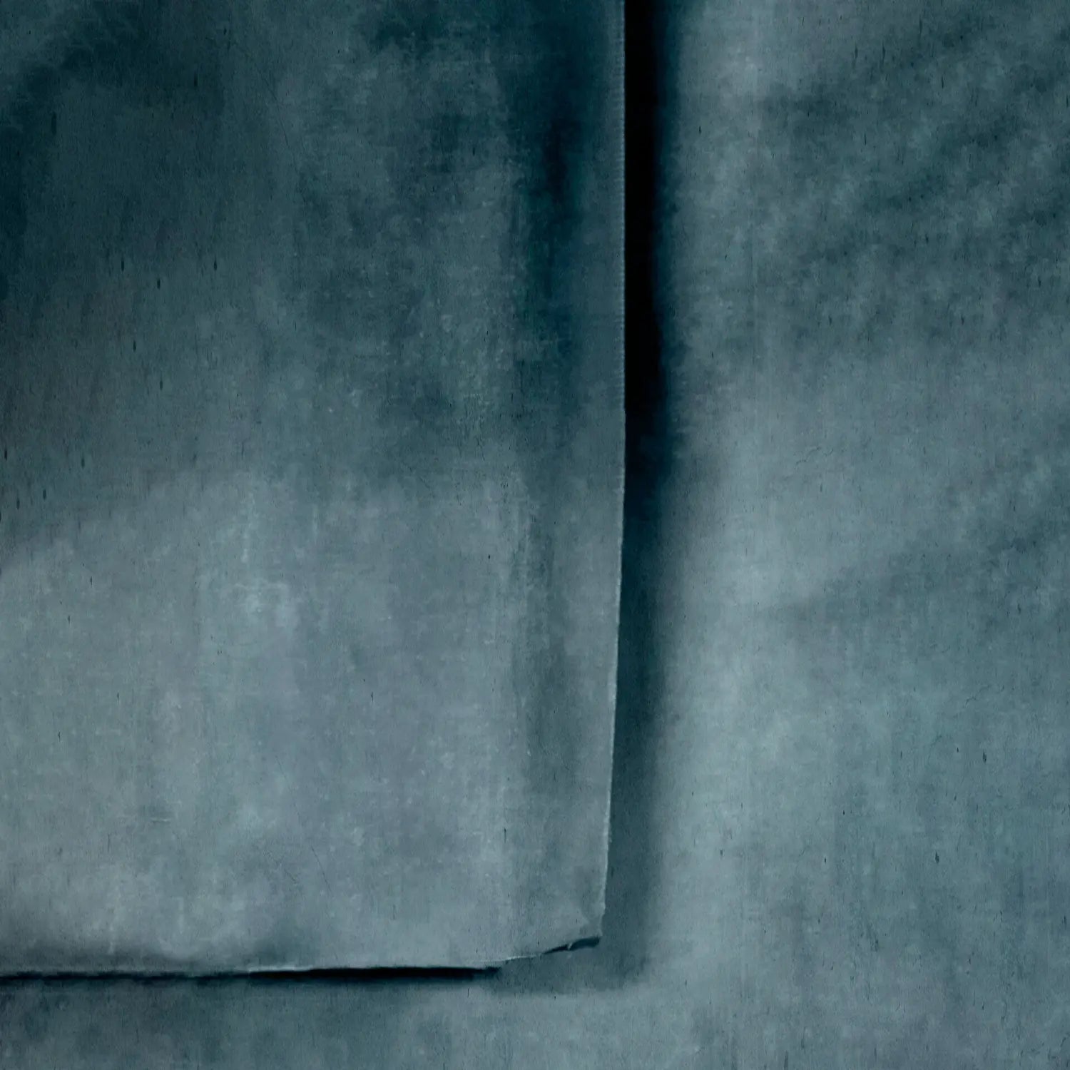 Close-up of textured blue fabric with a subtle pattern