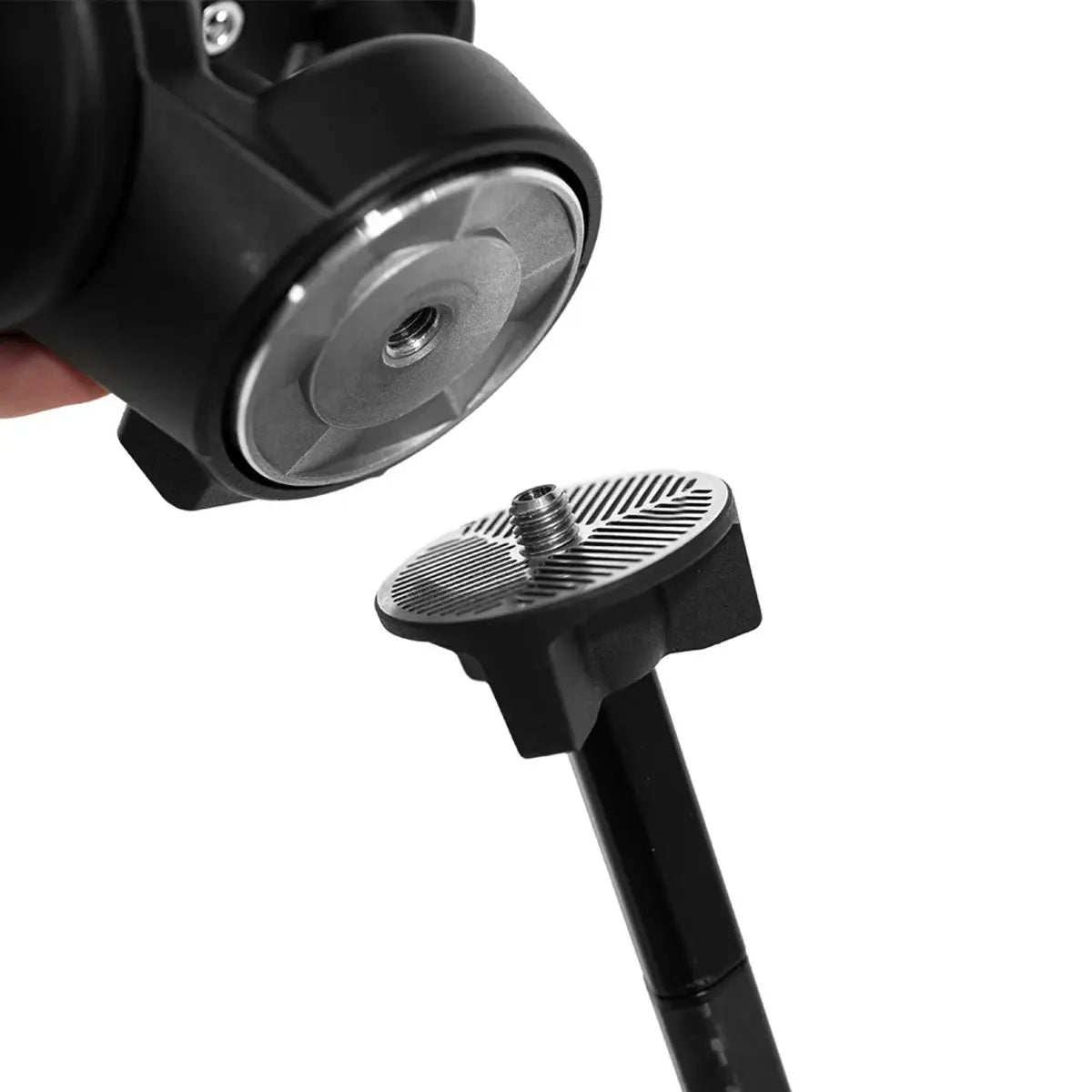 Close-up of a black and silver camera mount on a white background