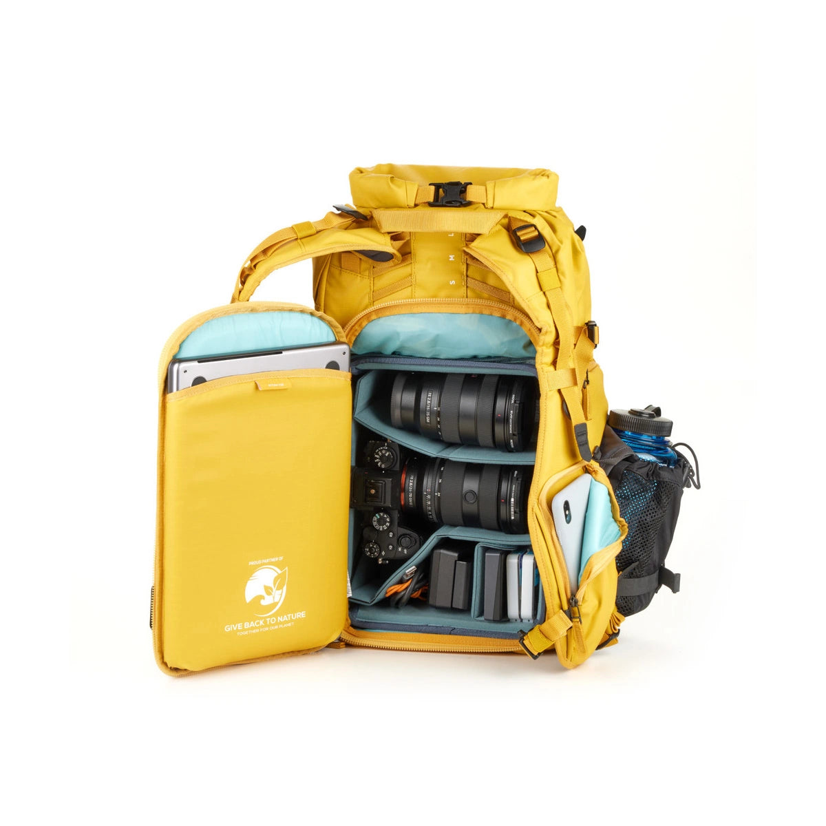 A yellow backpack shown open on a white background, filled with camera gear including lenses, a camera body, a tablet in a side pouch, and accessories.