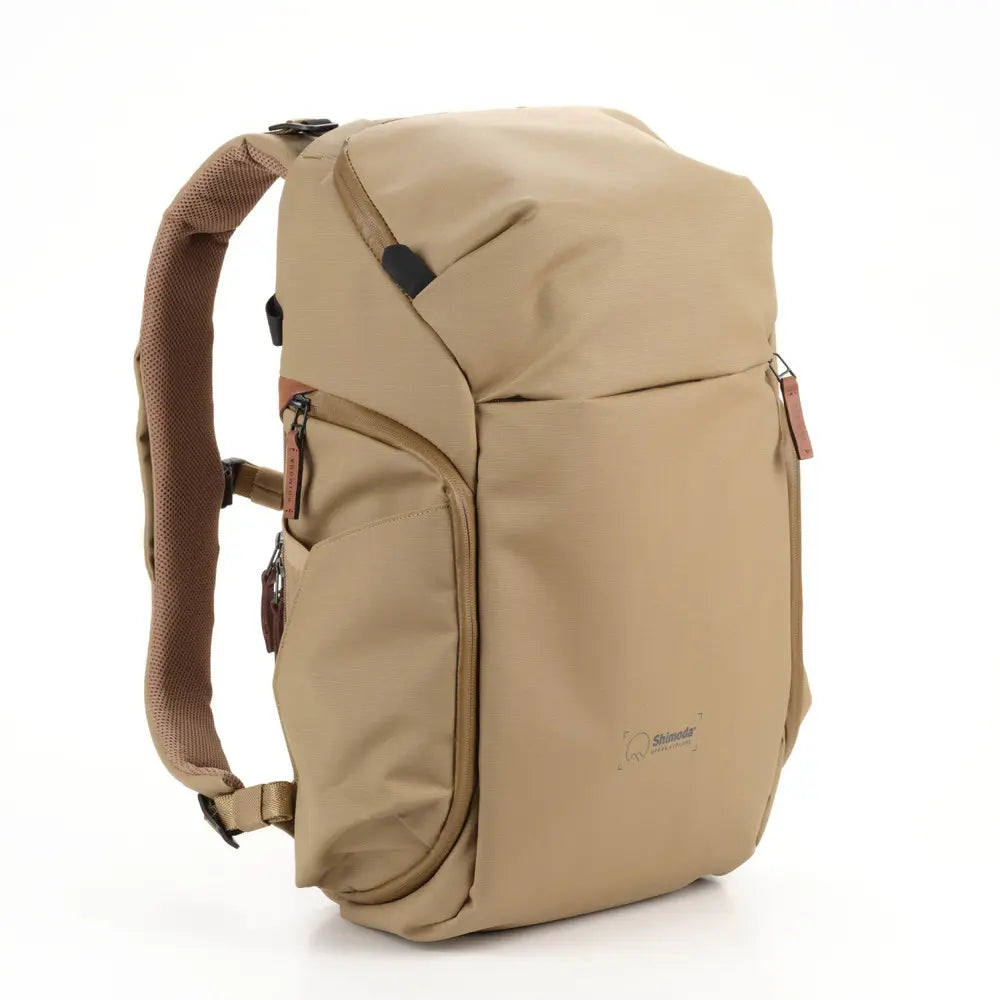 Beige backpack on a white background