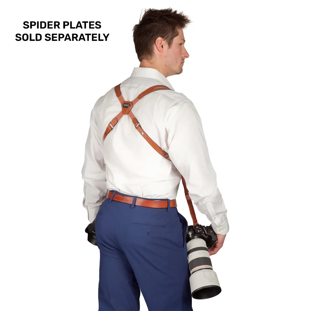 Person wearing brown leather suspenders with a camera, text 'SPIDER PLATES SOLD SEPARATELY' above.