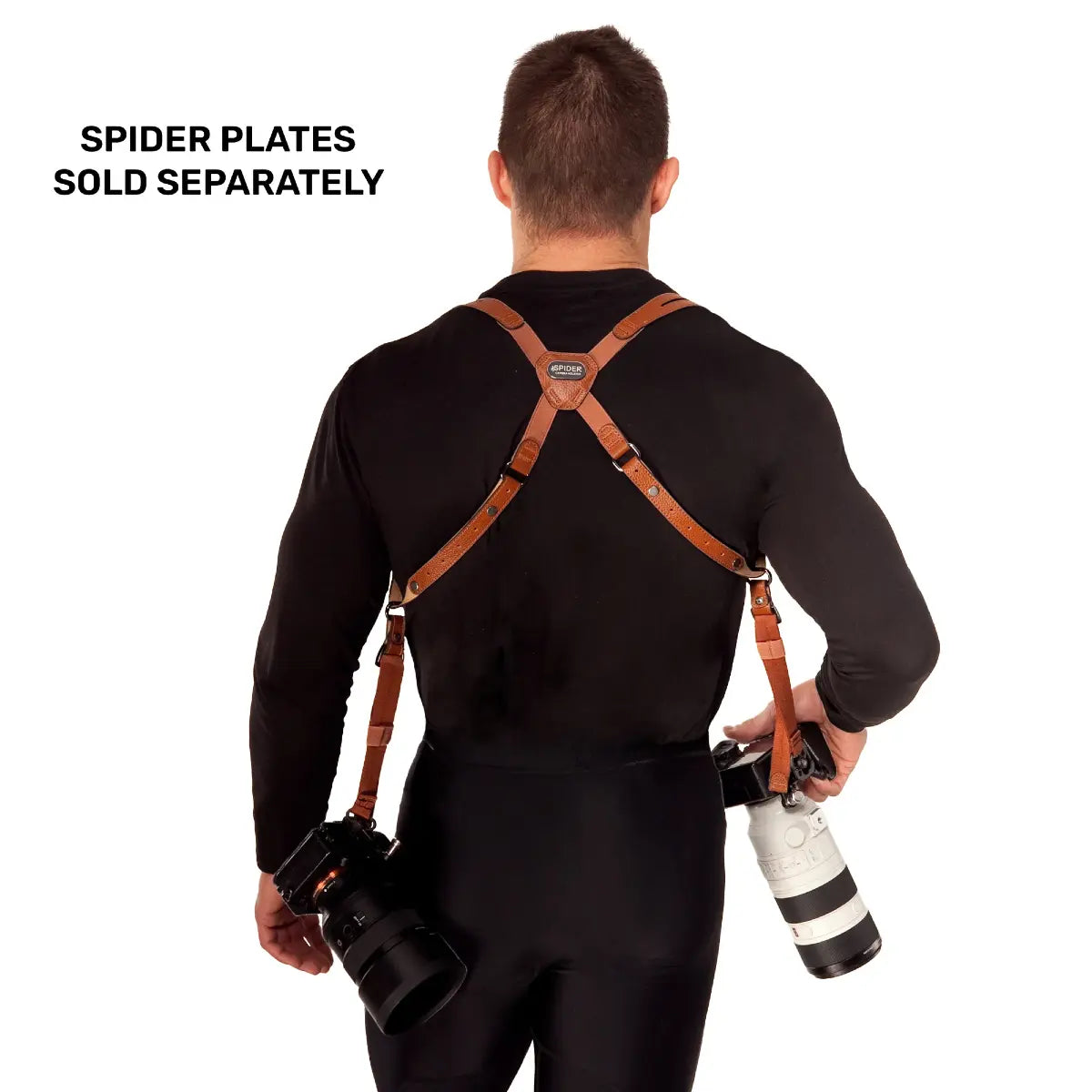 Person wearing a camera harness with two cameras attached, on a white background.