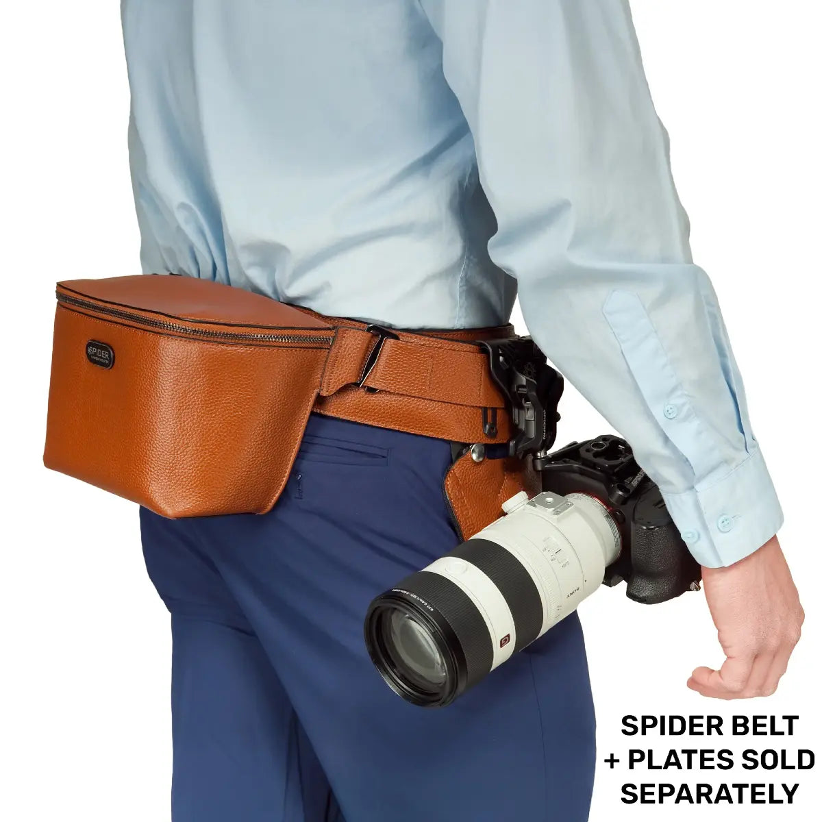 Person wearing a brown leather belt with a camera attached, on a white background.
