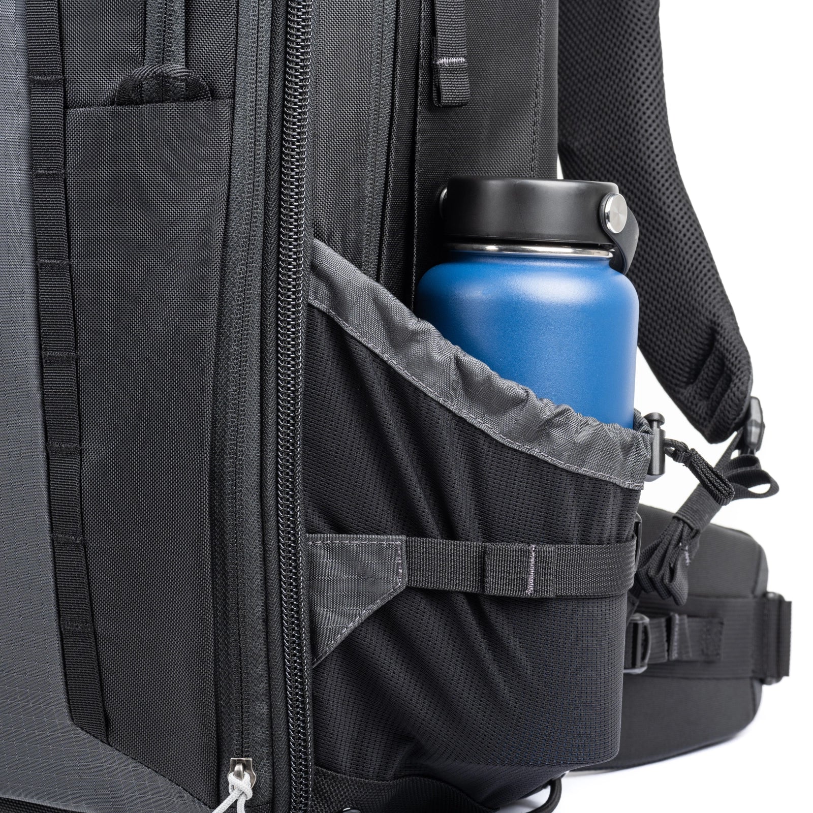 Think Tank FirstLight 46L+ side angle of water bottle pocket