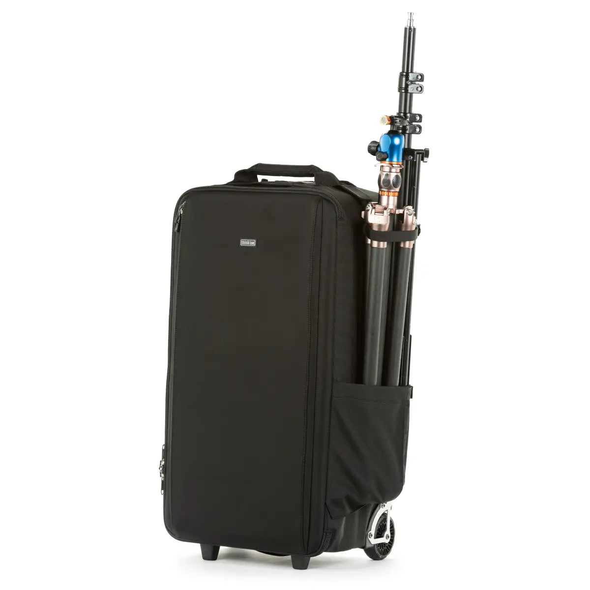 Black suitcase with a camera tripod inside on a white background