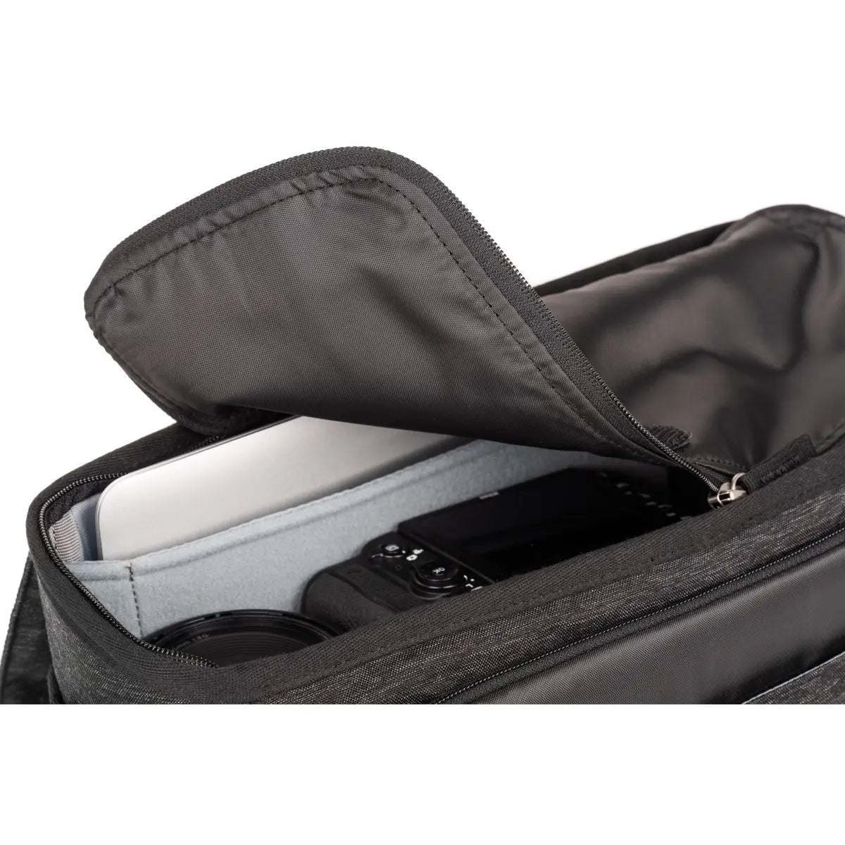 Black backpack with compartments and a phone inside on a white background