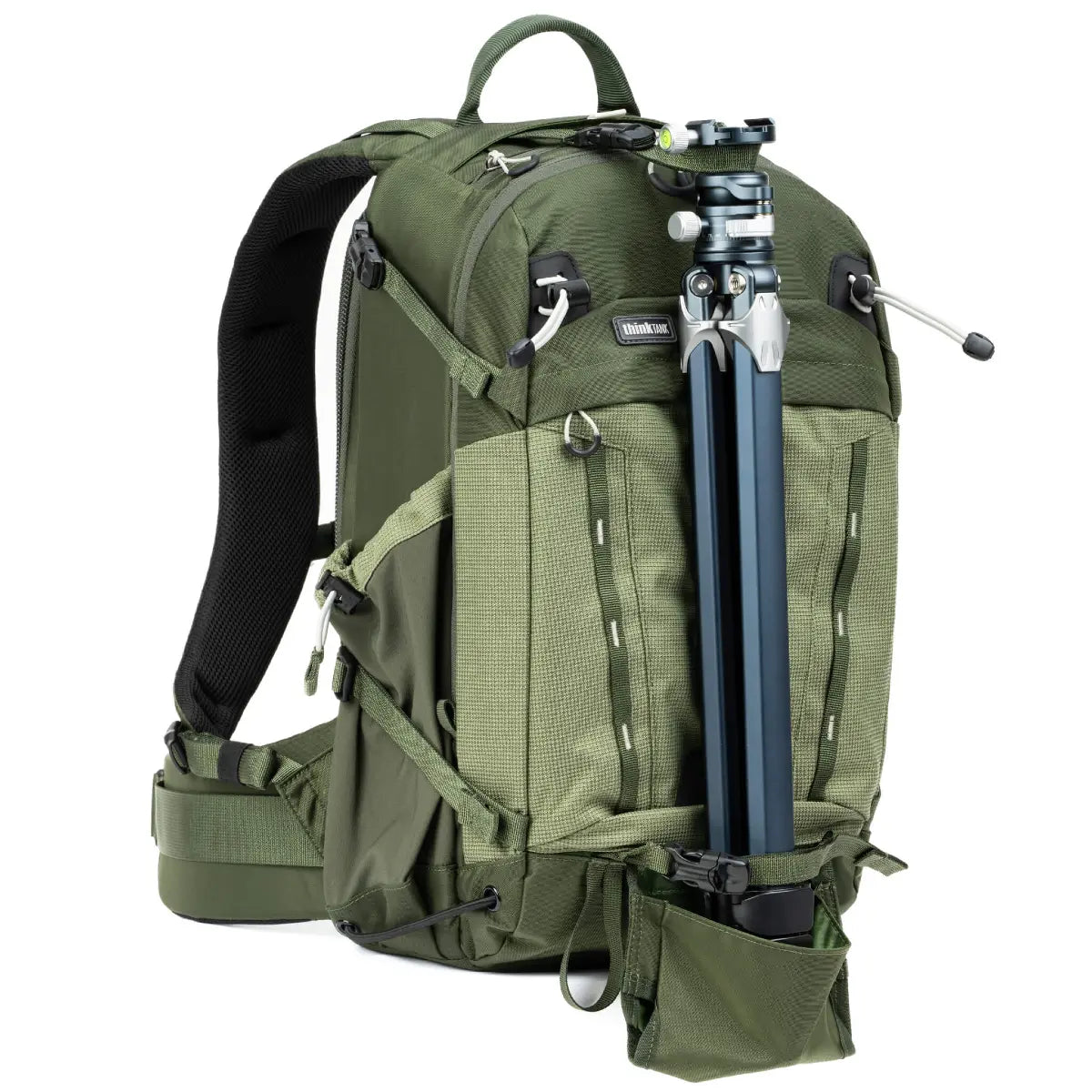 Green backpack with camera equipment on a white background