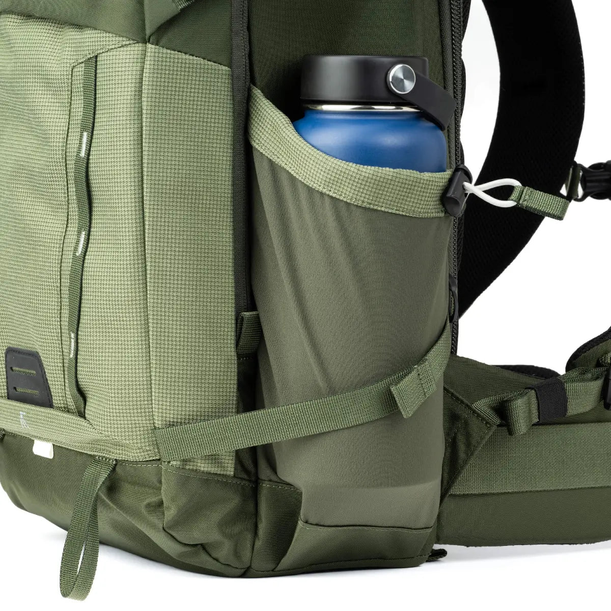 Green backpack with a blue water bottle in a side pocket on a white background