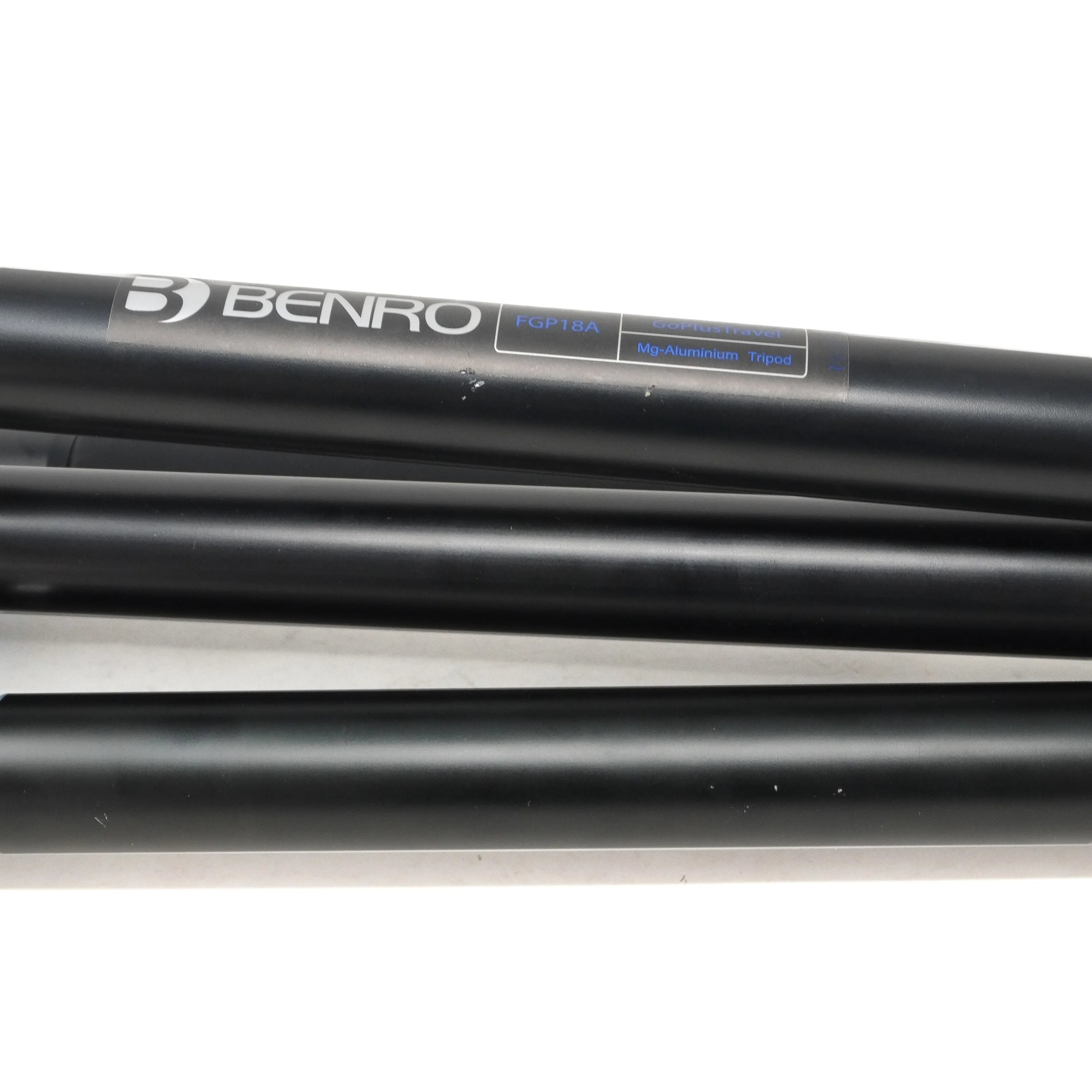 Black Benro tripod legs on a white background