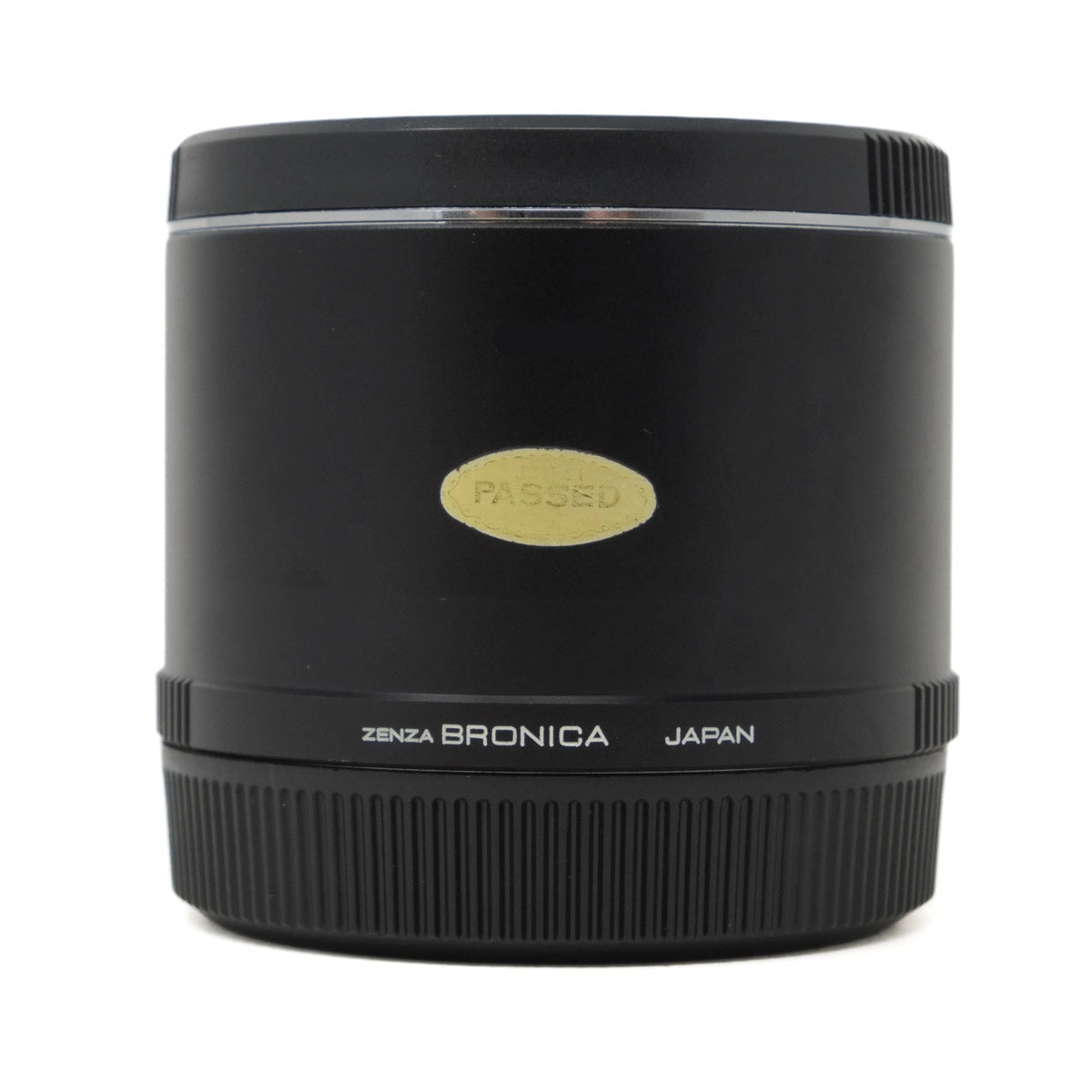 Black camera lens teleconverter with 'Zenza Bronica' branding on a white background
