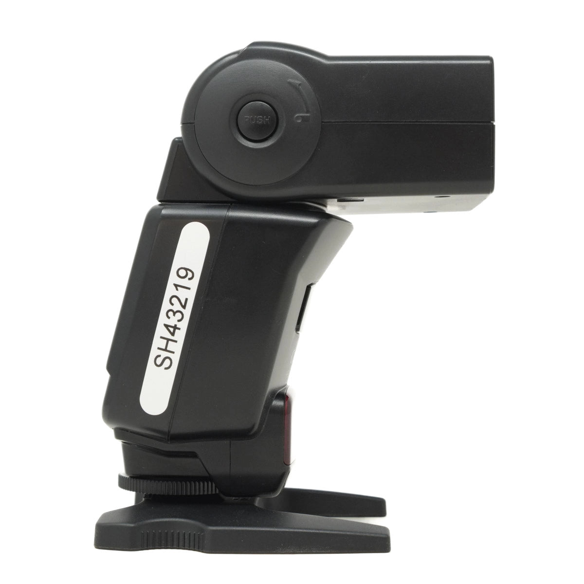 Black camera flash with a white label on a white background