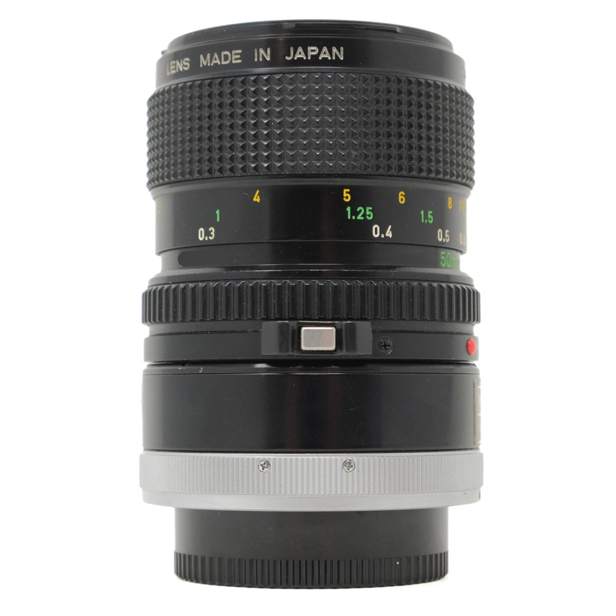 Camera lens with 'Made in Japan' text on a white background