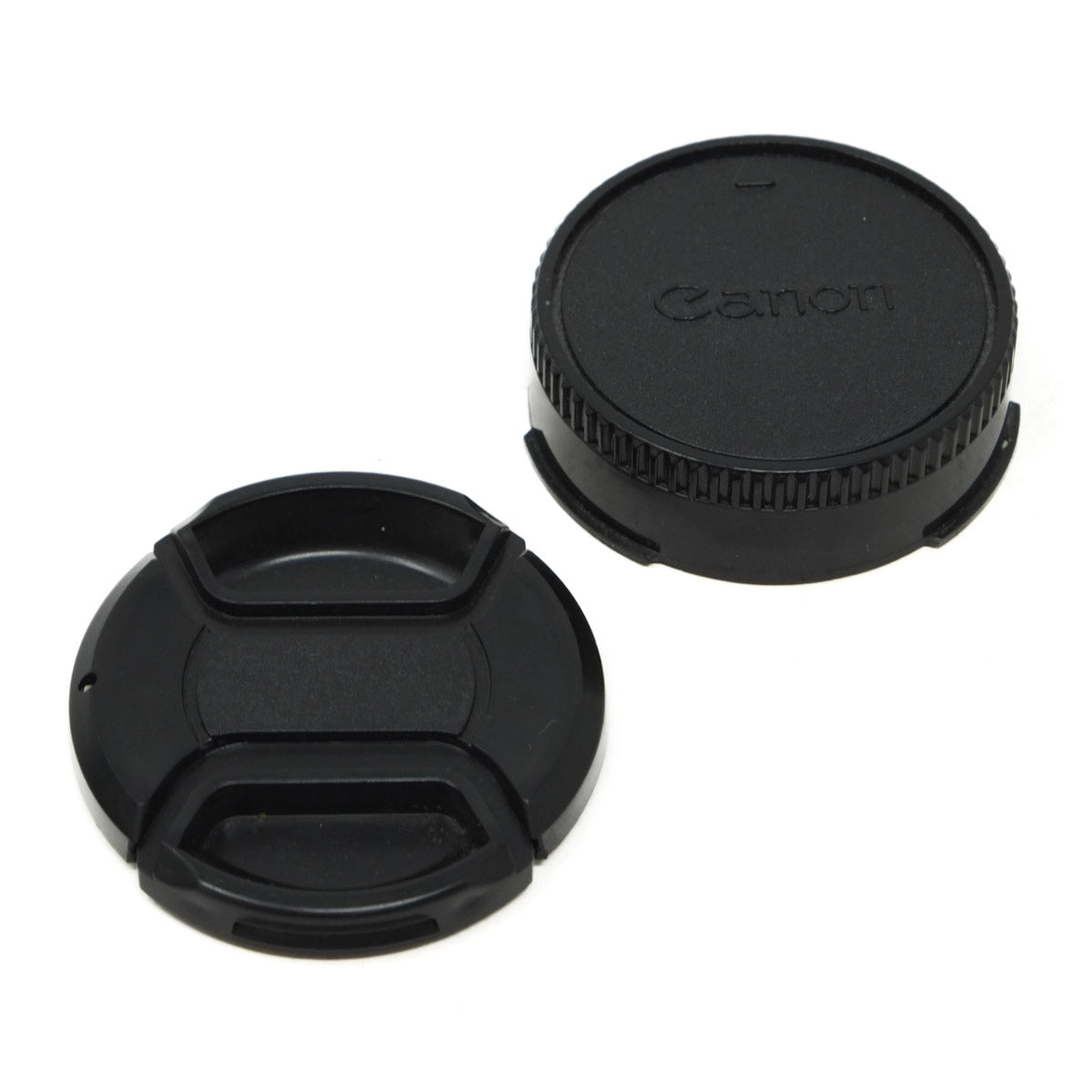 Two camera lens caps, one with Canon logo, on a white background