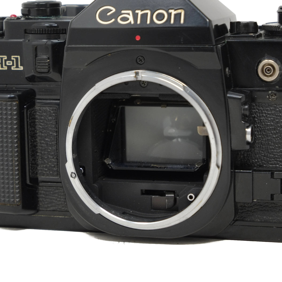 Canon camera body without a lens on a white background
