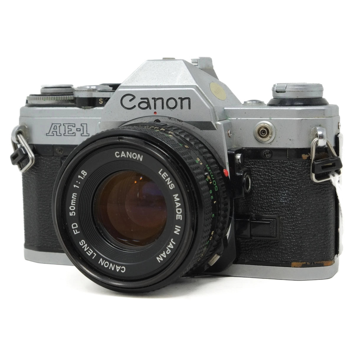 Canon AE-1 camera with lens on a white background
