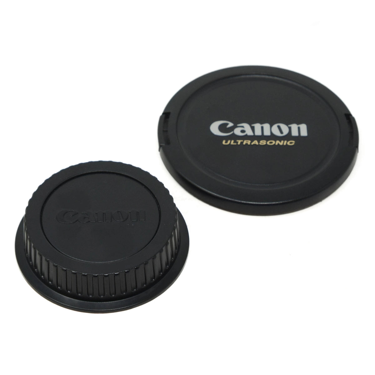 Canon lens cap and rear cap on a white background