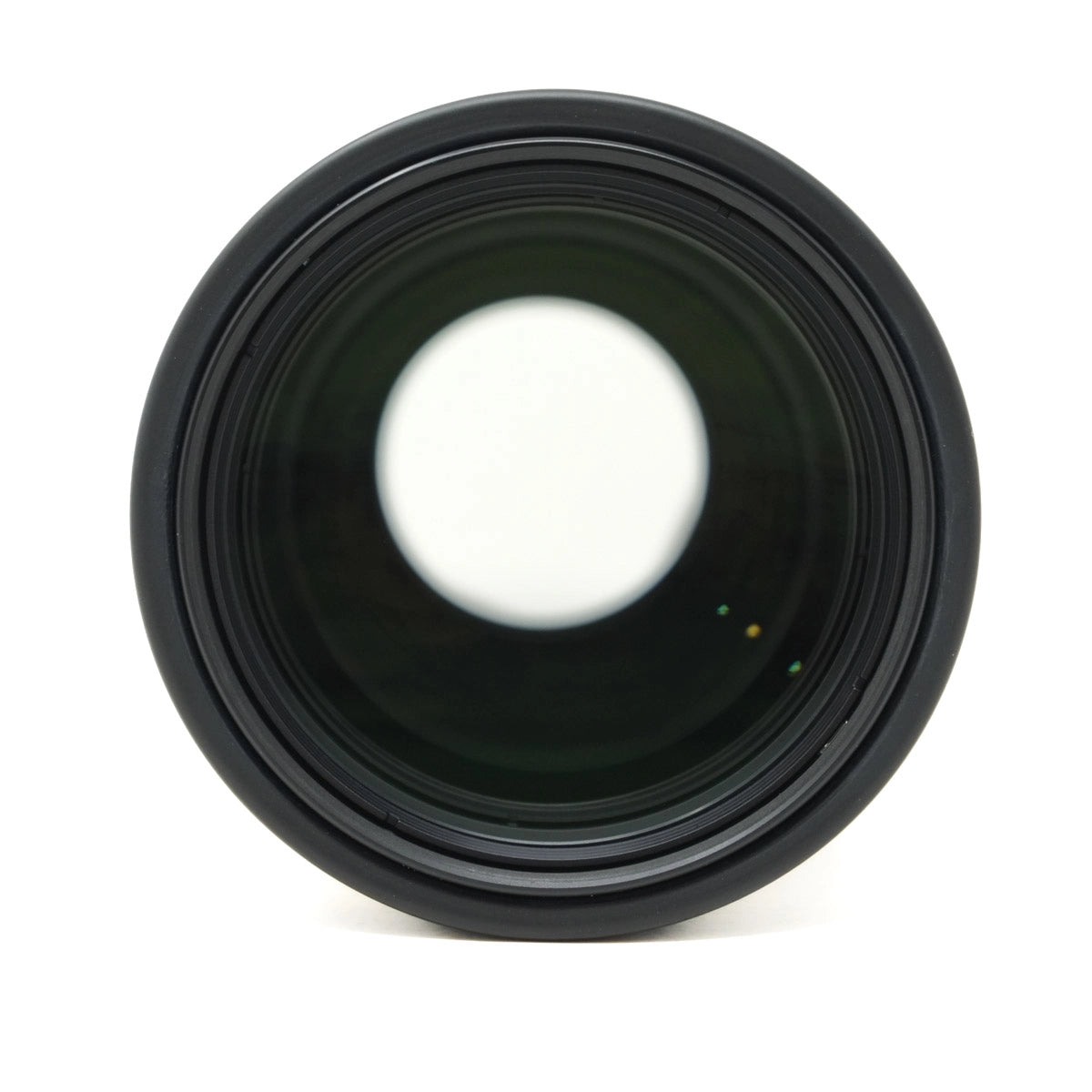 Black camera lens on a white background