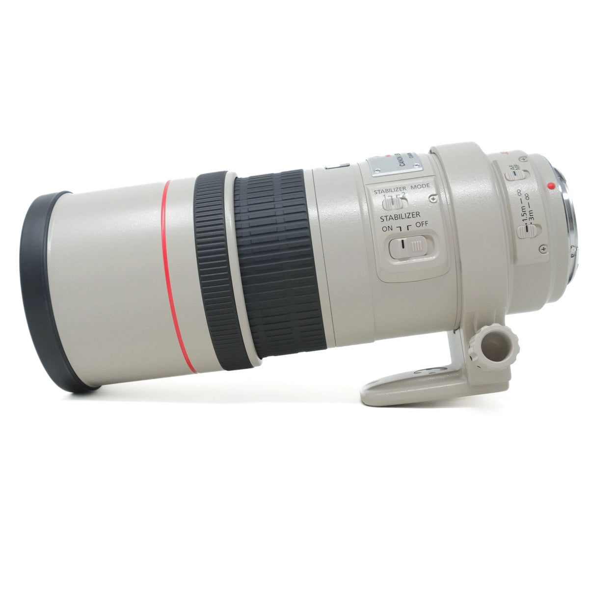 Camera lens with control buttons on a white background