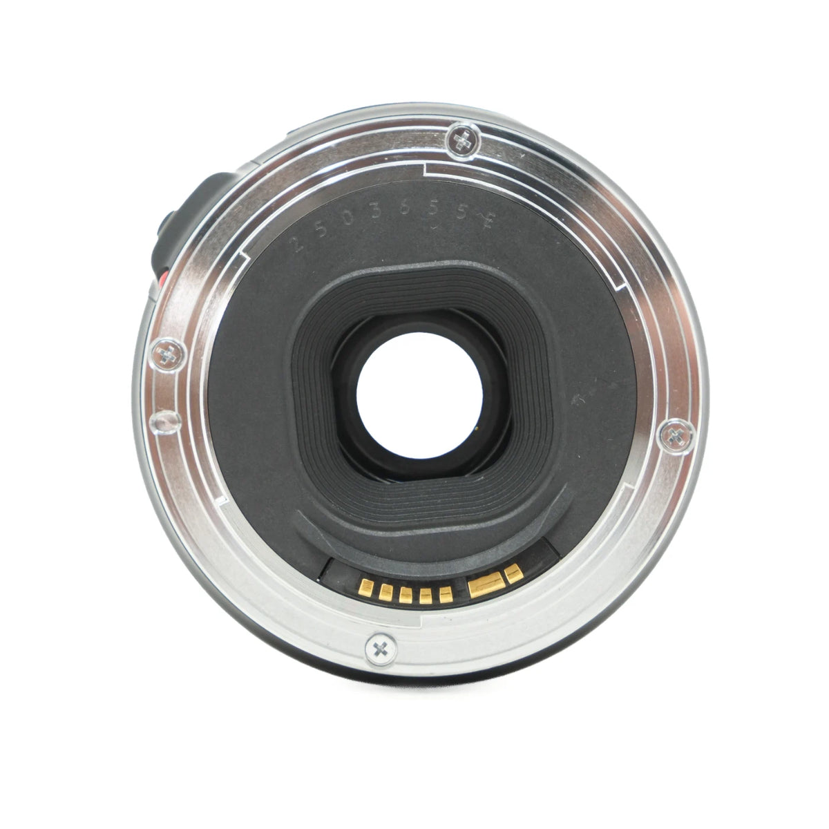 A close-up of a camera lens rear mount, showing the metallic silver outer ring, black internal filter thread, gold contact pins, and a central circular opening, isolated on a white background.