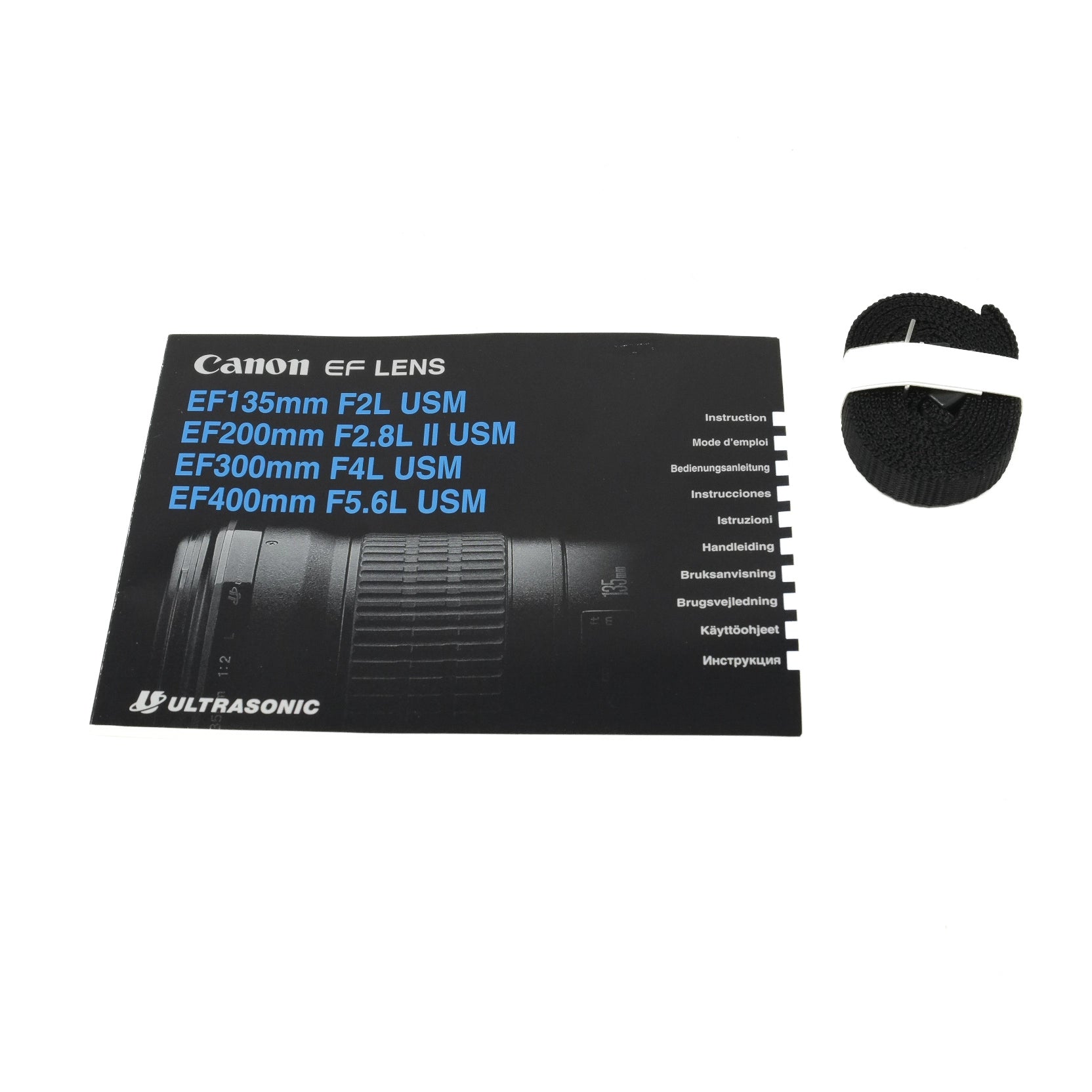 Canon lens instructions with strap on a white background