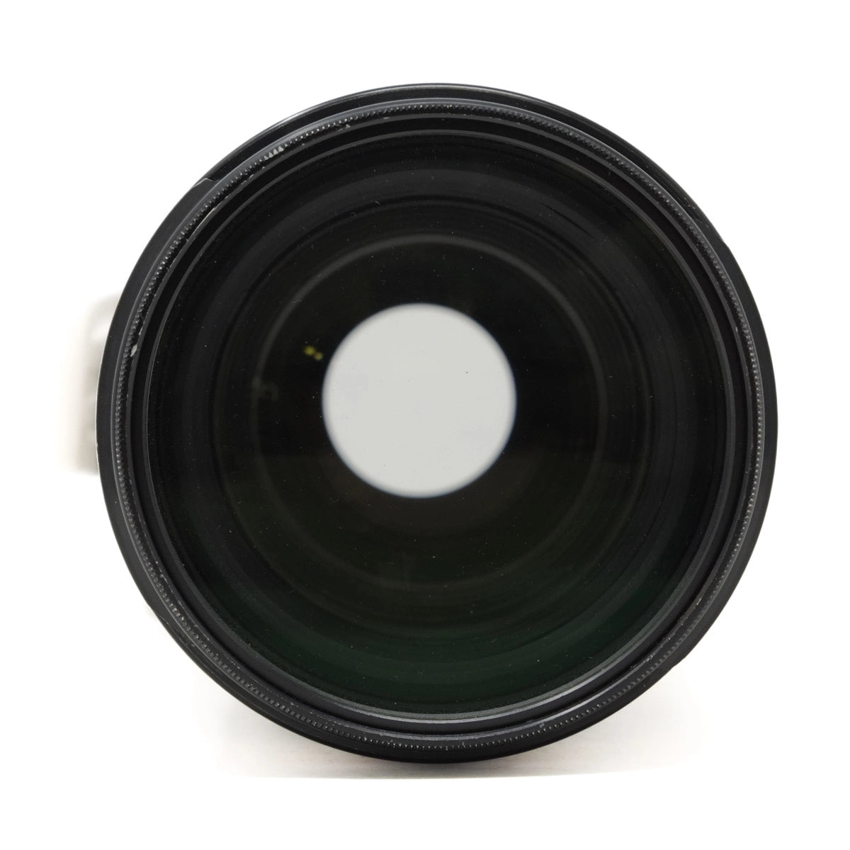 Black camera lens on a white background