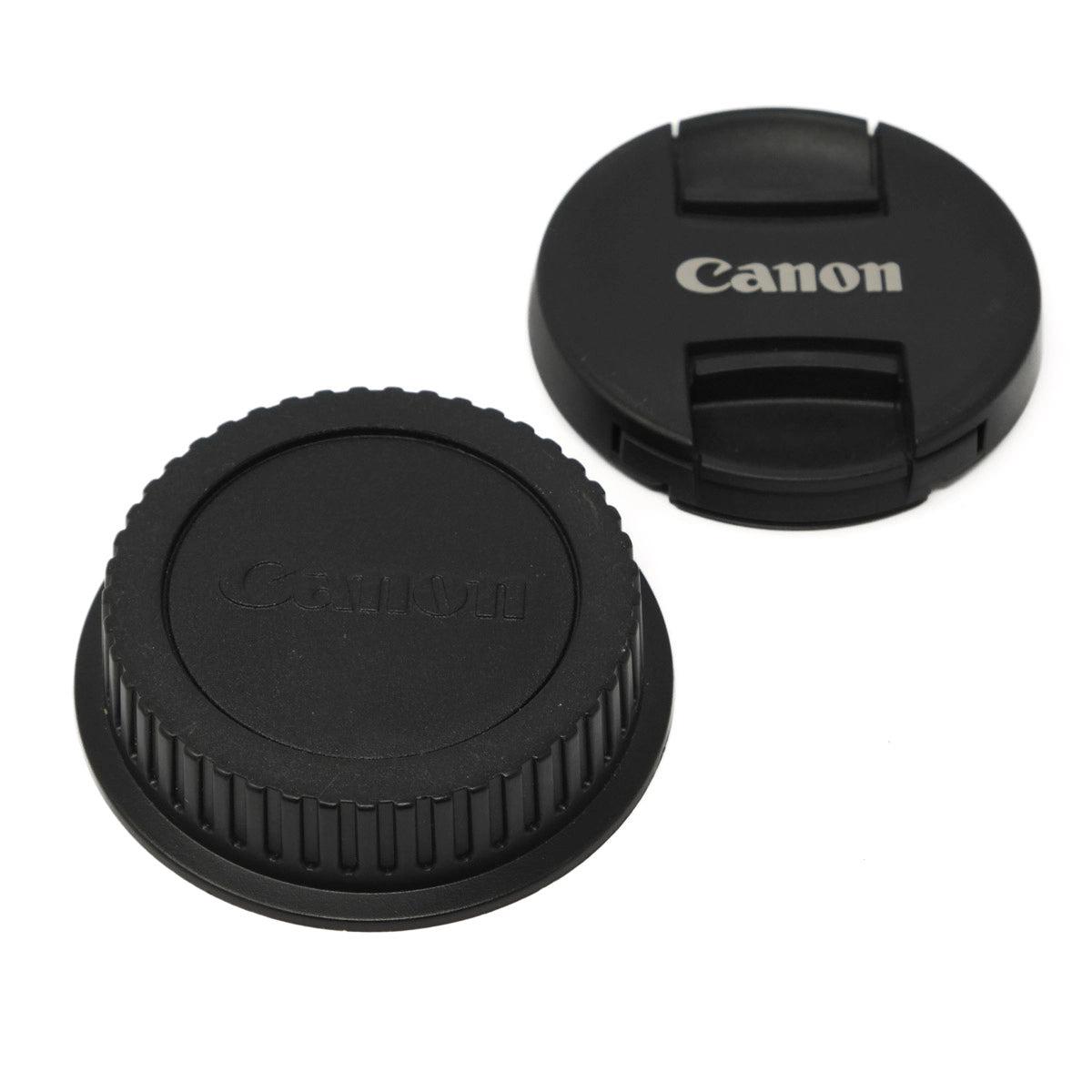 Canon camera lens cap and body cap on a white background