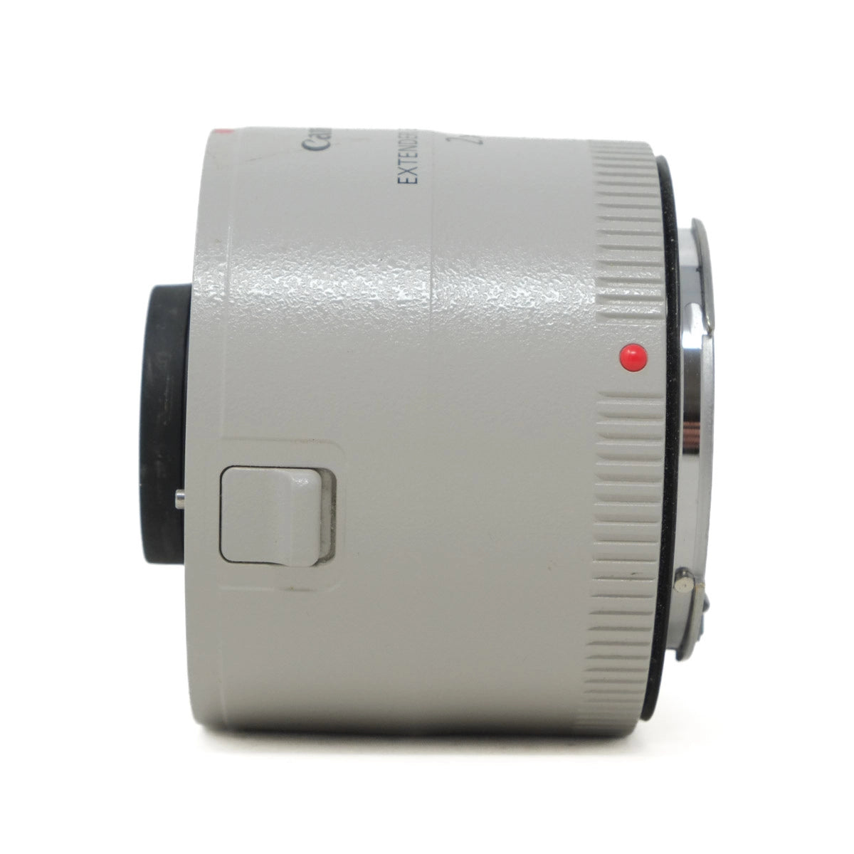 Close-up of a camera lens extender on a white background