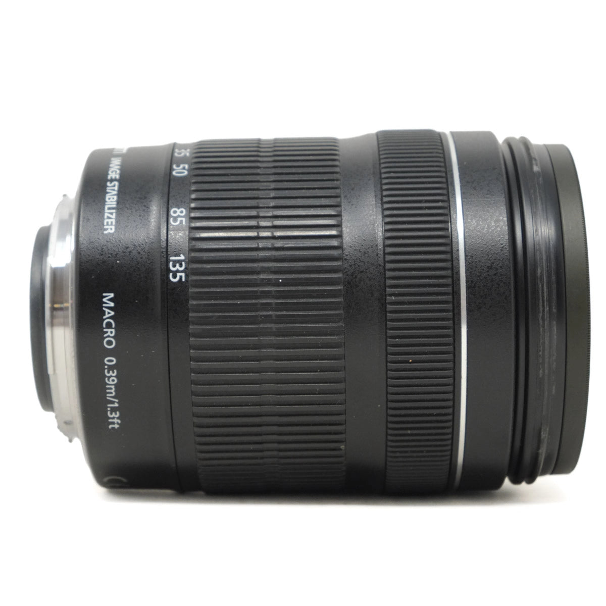 Camera lens with focus scale and text on a white background