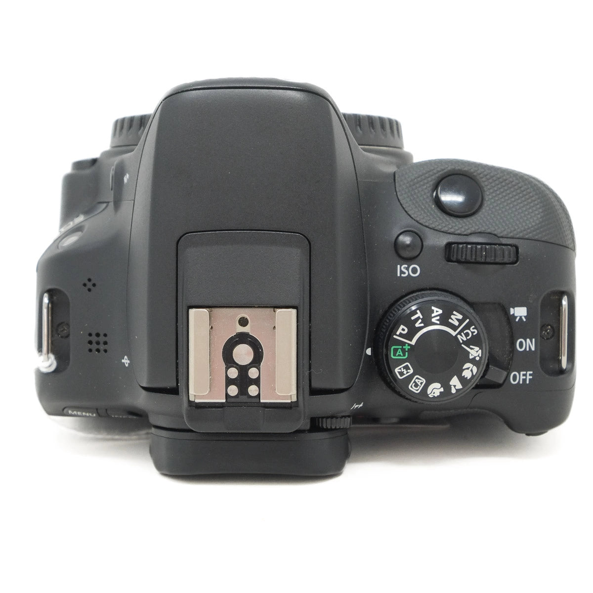 Top view of a DSLR camera on a white background