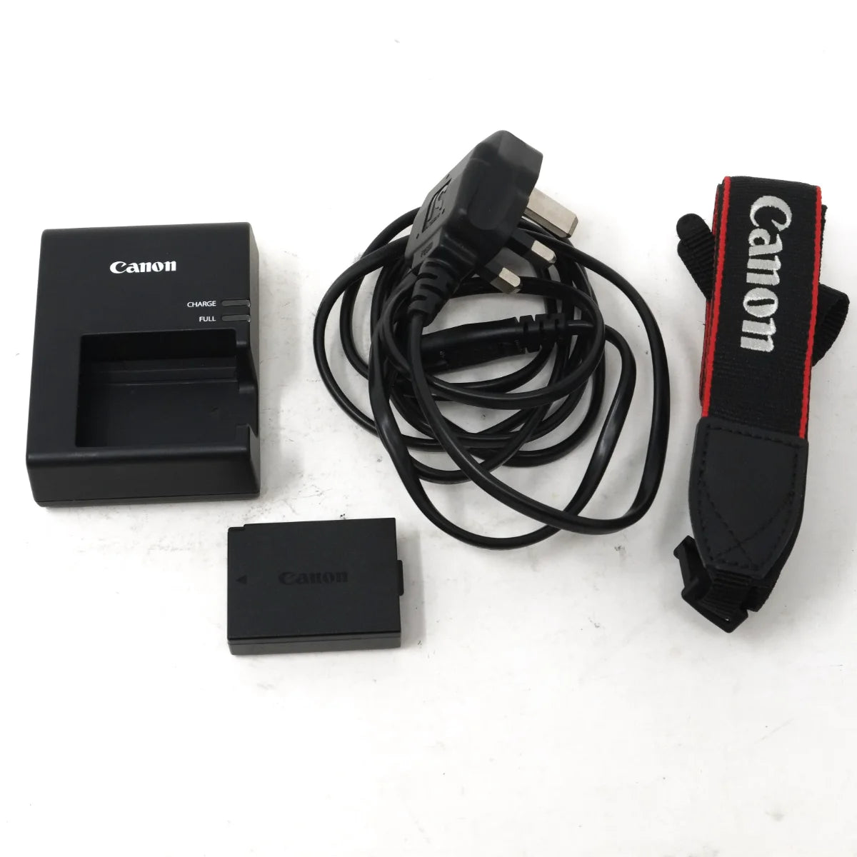 Used Canon EOS 4000D DSLR camera - battery charger, battery, strap