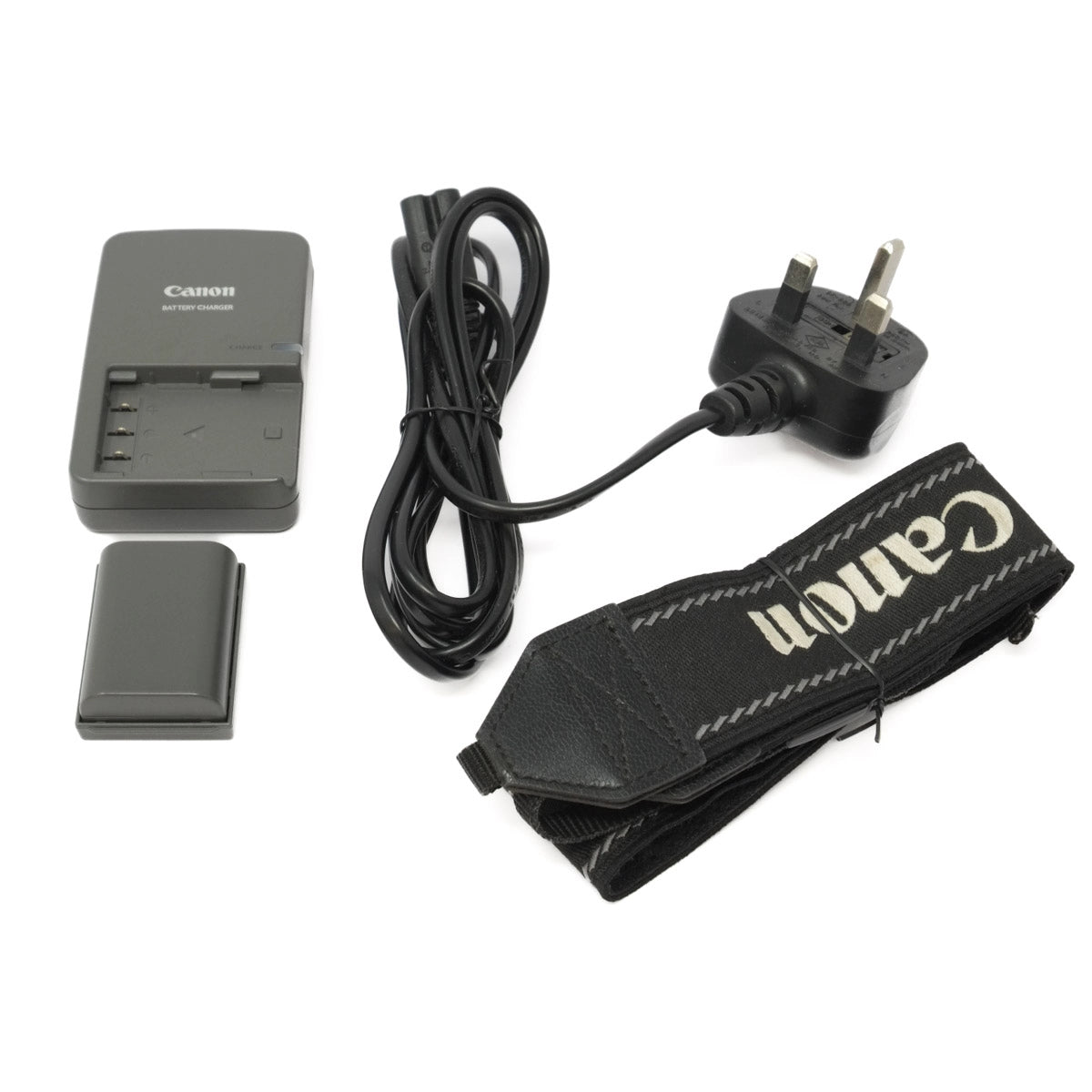 Canon camera battery, charger, strap, and plug on a white background
