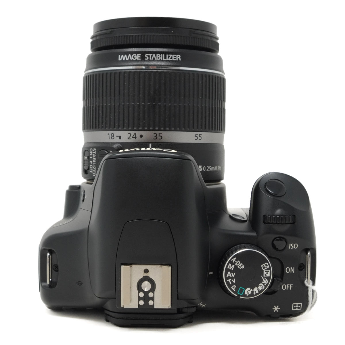 Black DSLR camera with lens on a white background