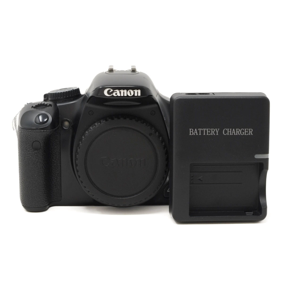 Canon DSLR camera with battery charger on a white background