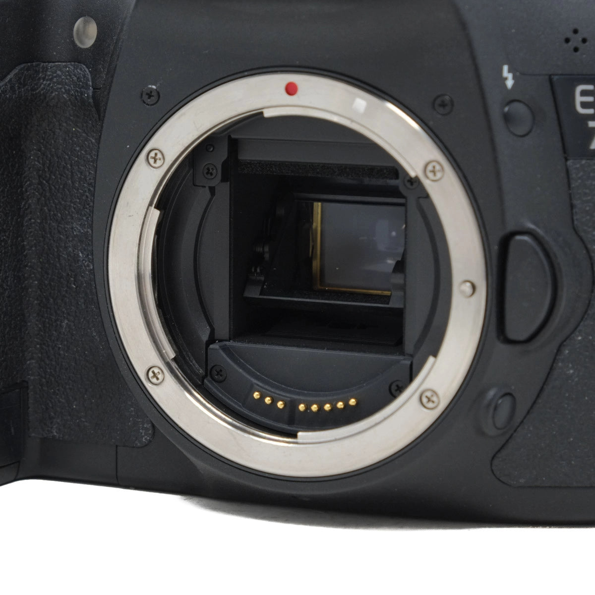 Close-up of a camera lens mount on a white background