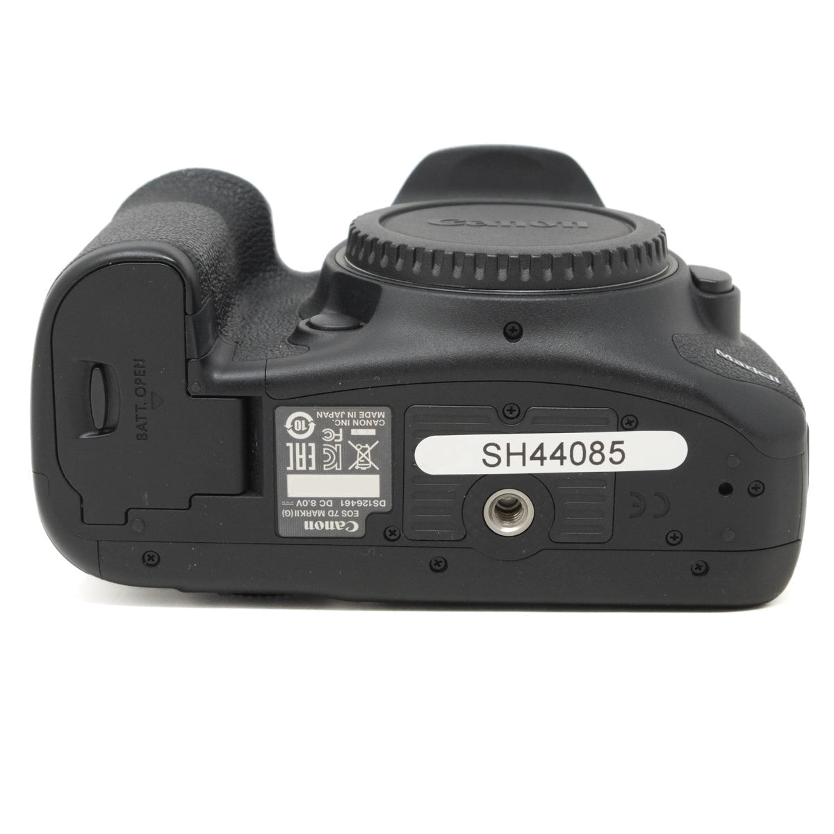 Bottom view of a black camera body on a white background