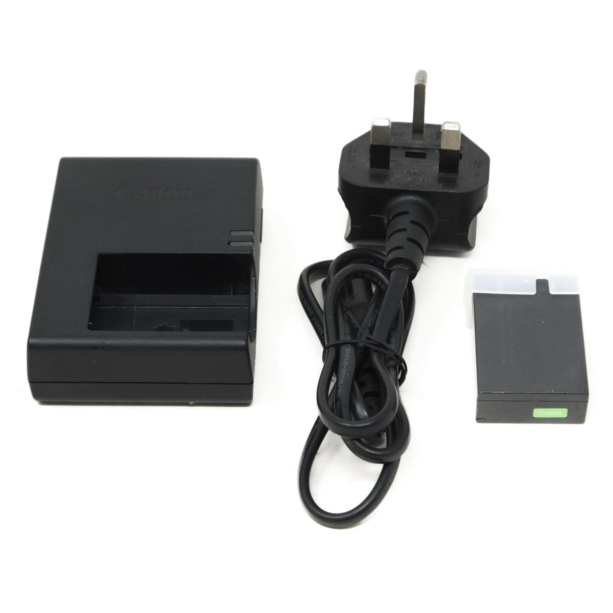 Black battery charger with power cord and battery on a white background
