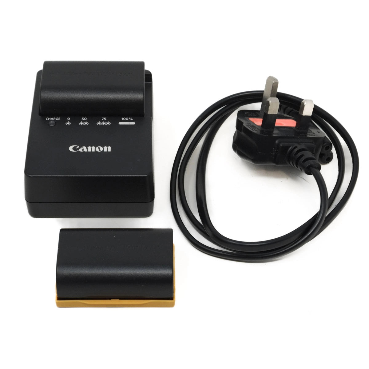 Canon battery charger with batteries and power cord on a white background