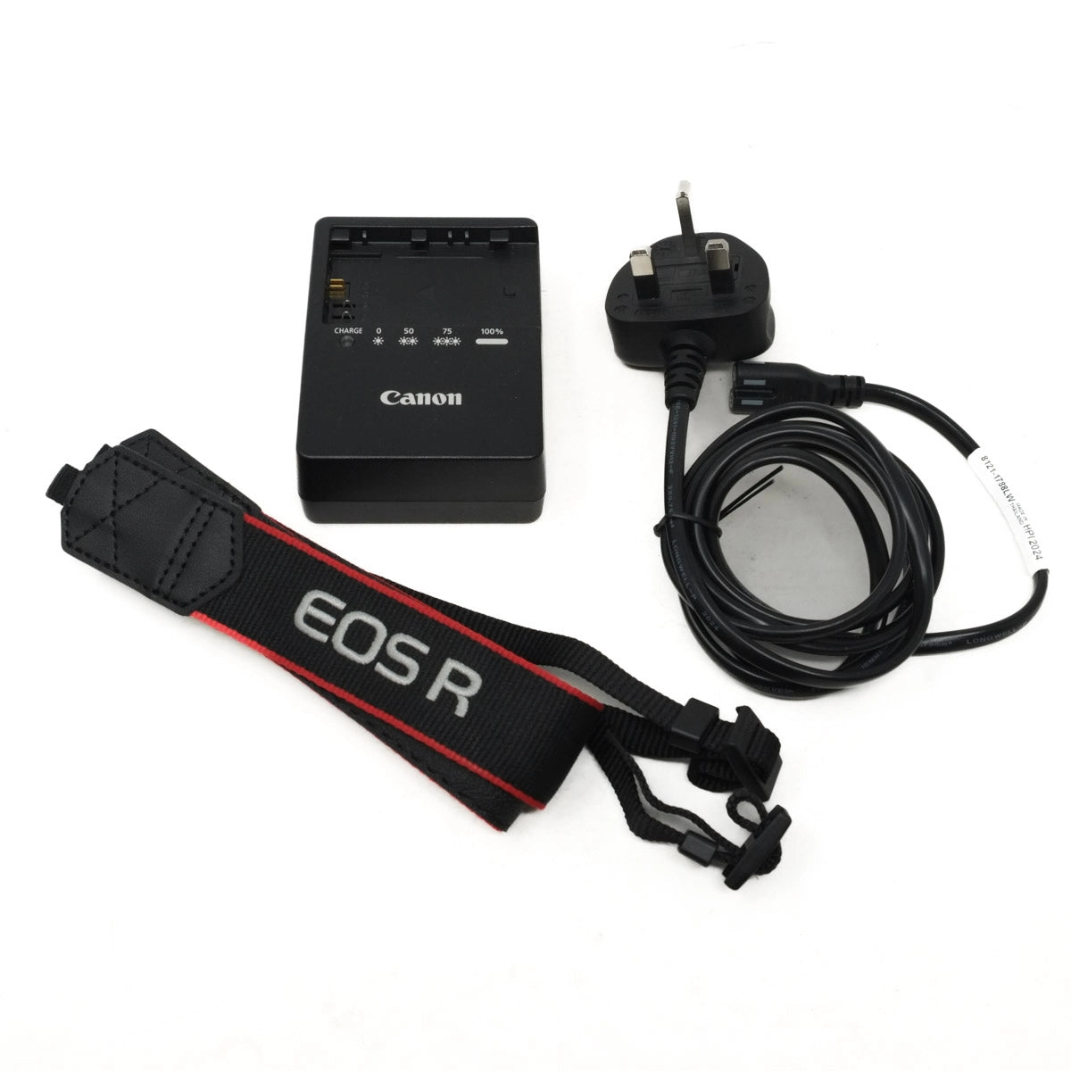 Canon camera battery charger, cable, and strap on a white background