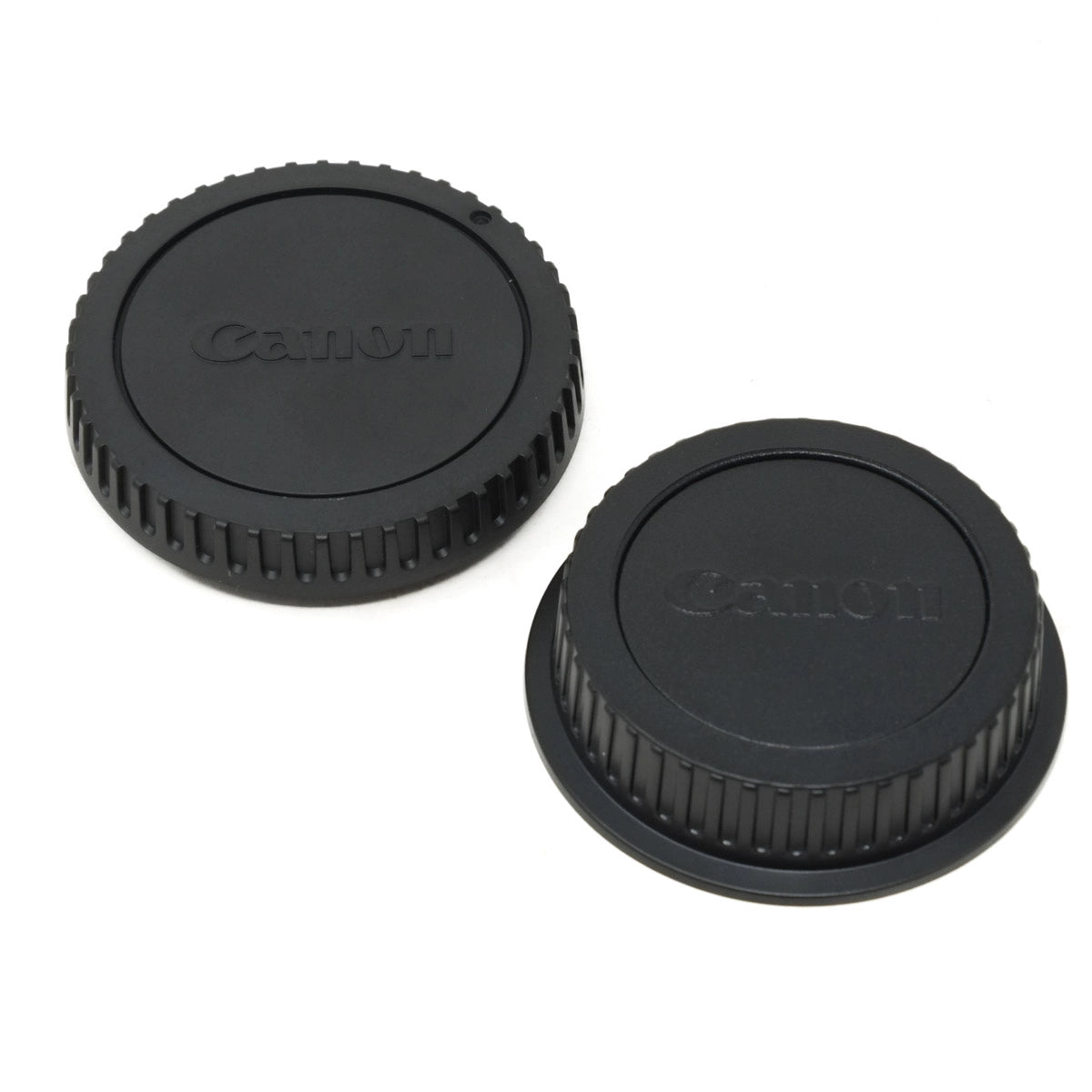 Two Canon camera lens caps on a white background