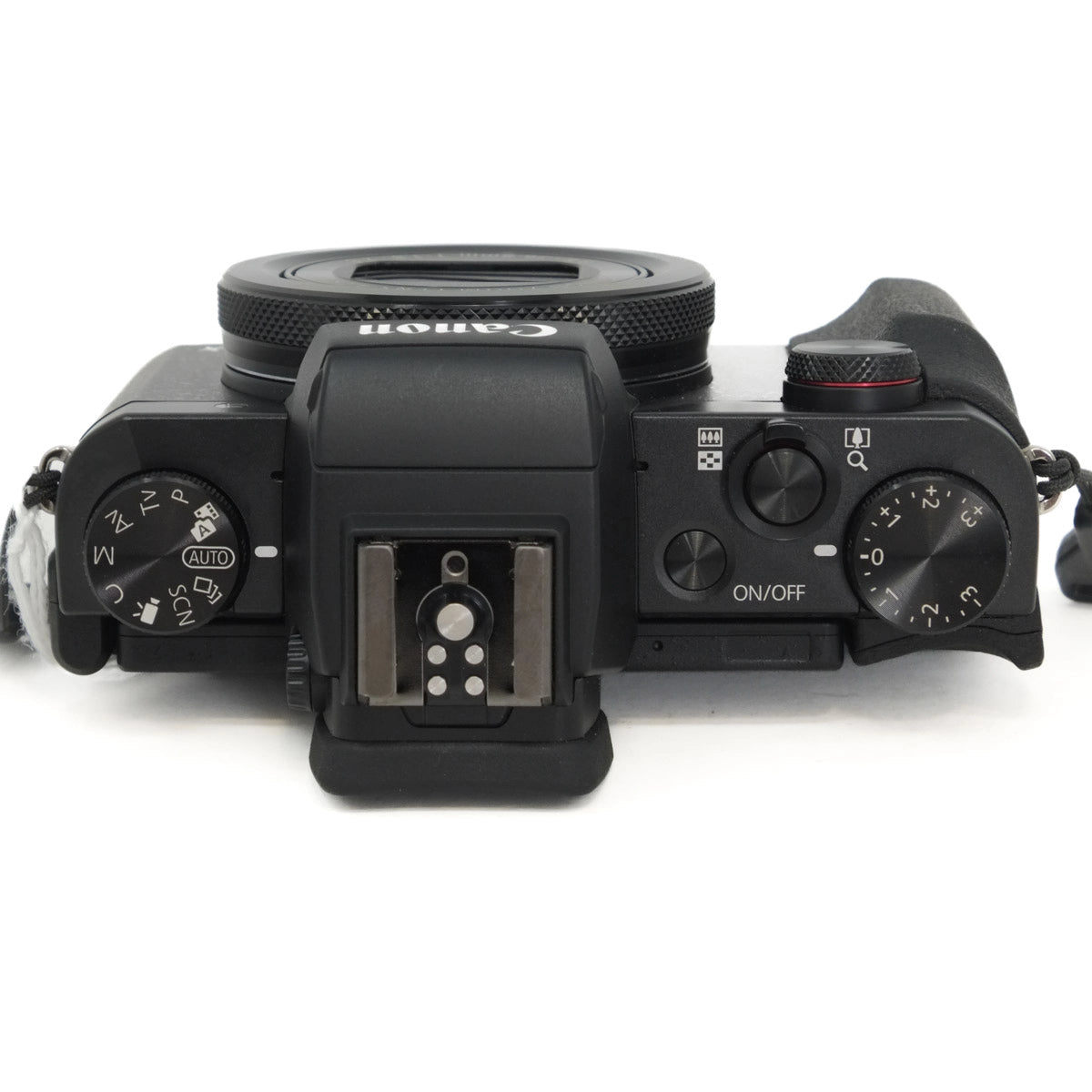 Top view of a black camera on a white background