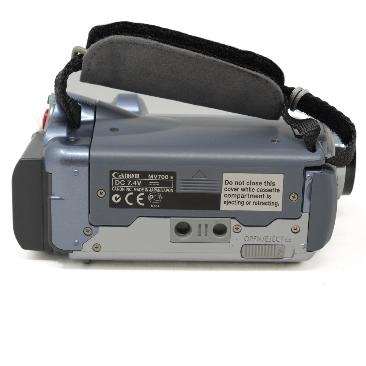 Bottom view of a Canon video camera on a white background