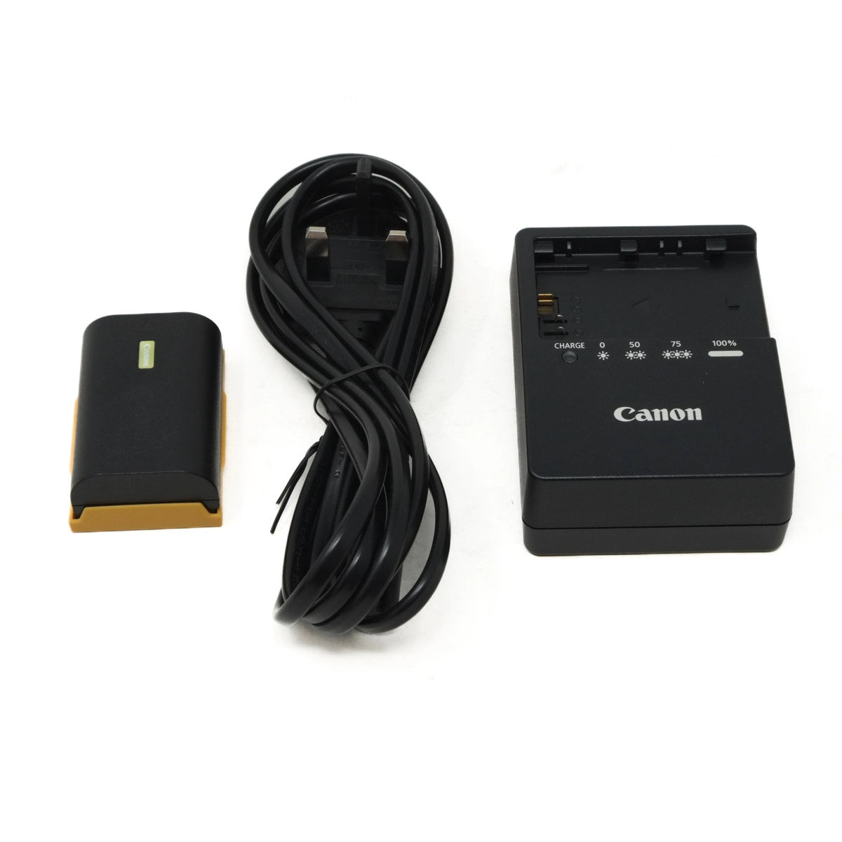 Canon battery charger with cable and battery on a white background